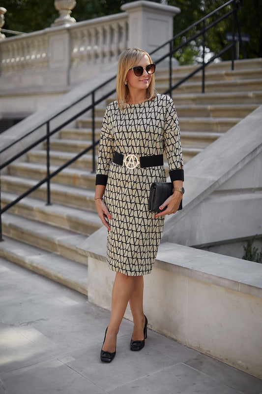 Beige and black knee-length dress with a belt included